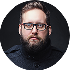 a man with beard formal photo with black background